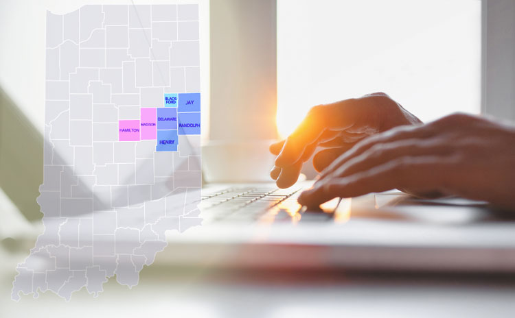 image of person on computer to find resources for pro bono services